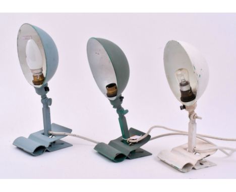 An assortment of three retro 20th century metal industrial clip-on inspection desk lamp light. Each light having an half dome