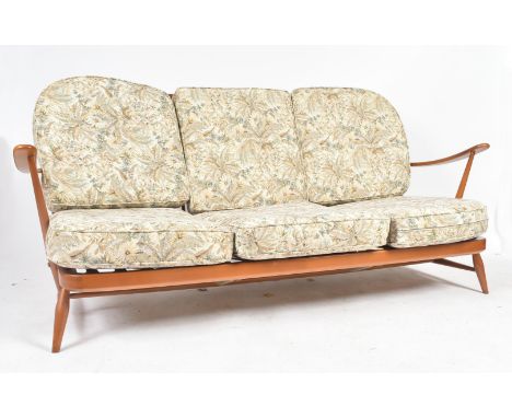 Lucian Ercolani - Ercol - Windsor model - A retro 1960s beech and elm dark stain two-seater sofa settee. The sofa having rais