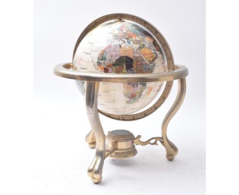 A vintage 20th century semi precious stone inlay desk top globe / terrestrial globe. The globe raised on&nbsp; gilt brass tur