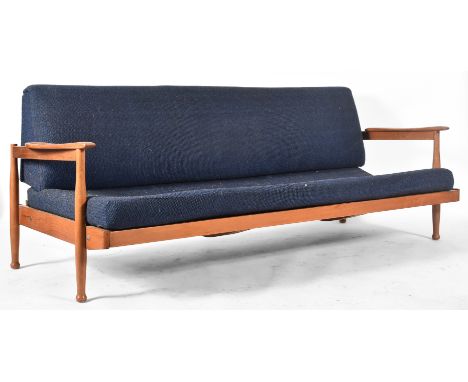 Guy Rogers - Manhattan - A retro mid century designer sofa / daybed having show wood angular teak frame with swept armrests. 