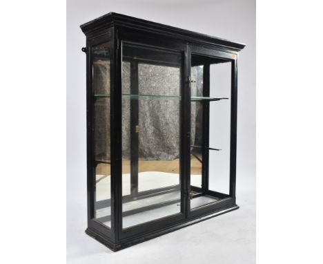 A late 19th century Victorian hanging glass and ebonised shop display cabinet. The cabinet having two full length doors with 