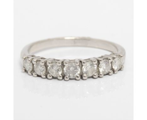 A seven stone diamond half eternity ring, set with seven round brilliant cut diamonds, total diamond weight approx. 0.52ct, u