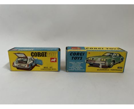 Corgi Toy number 345, MGC G.T. competition model together with Corgi Toys number 264, Oldsmobile Toronado