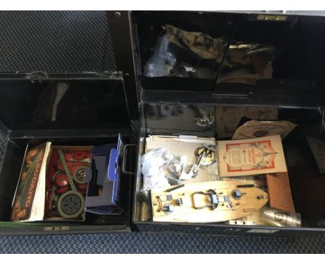 Two metal deed boxes containing a quantity of mixed items to include Meccano model boats etc.
