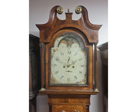 An oak and mahogany long-case mantle clock with revolving moon face, with weights and pendulum