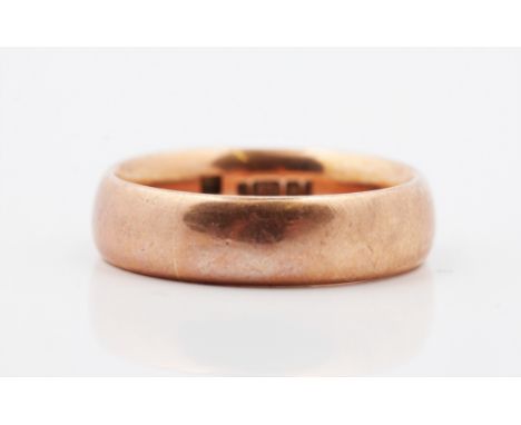 A hallmarked 9ct rose gold plain wedding band, ring size U, approx. weight 10.5g.