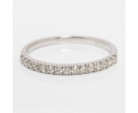 A hallmarked 9ct white gold diamond half eternity ring, set with fifteen round brilliant cut diamonds, total diamond weight a