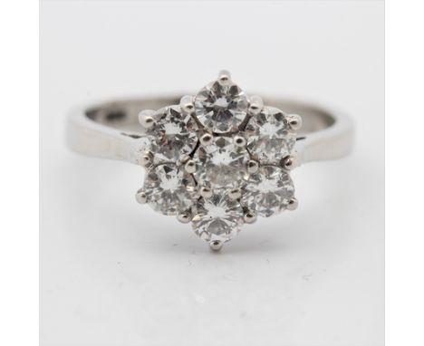 A diamond cluster ring, set with seven round brilliant cut diamonds, total diamond weight approx. 1.40ct, indistinctly stampe