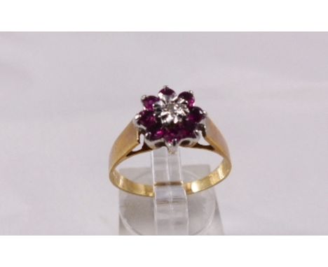 9CT DIAMOND RING. 9ct yellow gold diamond and ruby set ring, size P, 2,4g