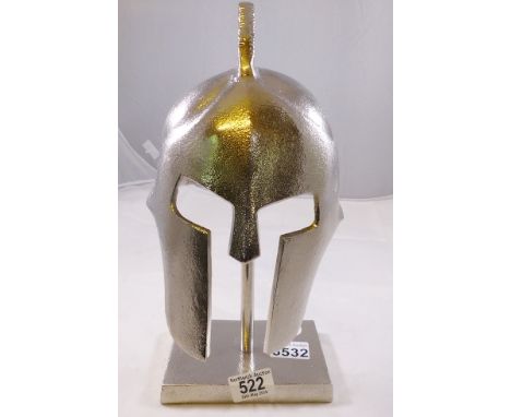 MODEL SPARTAN HELMET. Model of a white metal spartan style helmet 