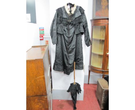 A Victorian Ladies Mourning Moire Taffeta Skirt and Jacket, with jet beading to skirt and a parasol; A Circa 1910 Black Silk 