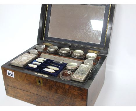A Mid XIX Century Walnut Cased Travelling Ladies Toilet Case, the lid with central brass cartouche, the mirrored interior wit