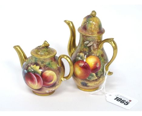 A Royal Worcester Porcelain Miniature Coffee Pot and Cover, painted by J. Skerrett, signed, with ripening fruit on a mossy wo