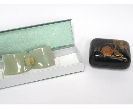 A Chinese Mid XX Century Jade Belt Buckle, with a chilong head hook, 10.5cm long; A Rectangular Lacquer Box, with figures in 