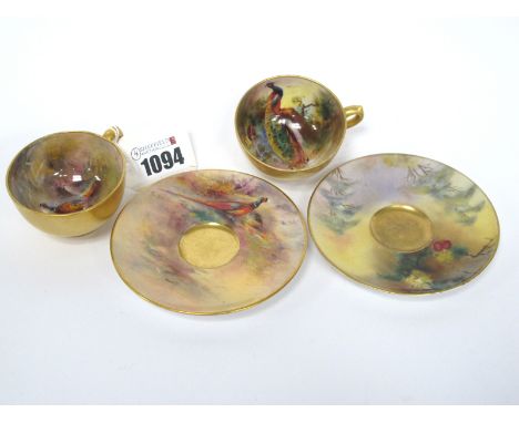 A Royal Worcester Porcelain Cabinet Cup and Saucer, painted by James Stinton, signed, with pheasants in a wooded landscape, d
