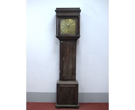 An XVIII Century Oak Thirty-Hour Longcase Clock, the hood with stepped pediment, blind fret frieze and column supports, brass