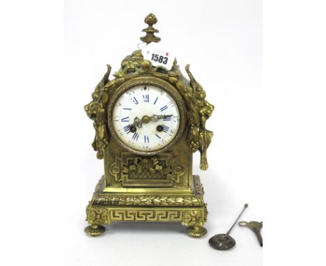A Late XIX Century Mantle Clock, the gilt metal case elaborately cast with lion mask handles, ribbons, Greek key pattern 'wre