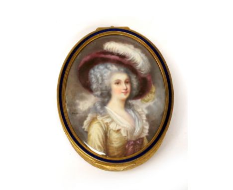 An Early XX Century Oval Gilt Metal Trinket Box, the lid painted with a portrait of a lady wearing a feathered hat and cream 