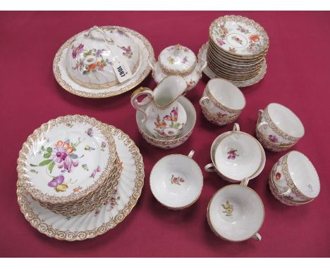 An Early XX Century Dresden Porcelain Fluted Tea Service, decorated with sprays of flowers within scrolling gilt borders, pri