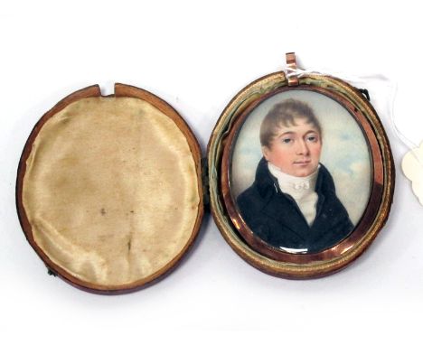 A Portrait Miniature of a Gentleman, wearing a white shirt and black jacket, unsigned on ivory, the yellow metal mount with g