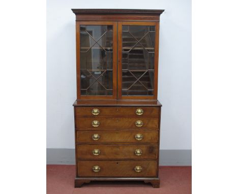 An Early XIX Century and Later Mahogany Secretaire Bookcase, the top with dentil cornice over twin astragal doors, the base w