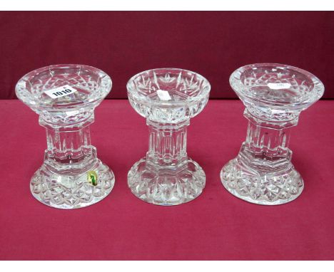 A Pair of Waterford Crystal 'Lismore' Pattern Candle Pillars, etched mark and label, 14cm high; Another, similar, 13.5cm high