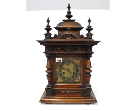A Late XIX Century Mahogany Cased Mantle Clock, of architectural form with moulded and turned decoration, the brass face with