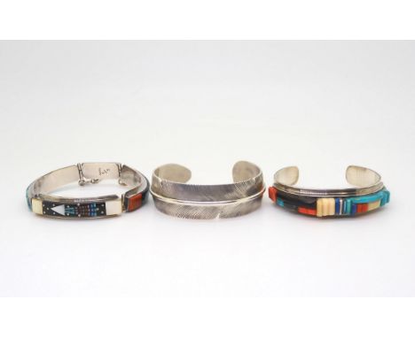 Three silver&nbsp;Navajo Native American bangles, to include a Sherry Sadoval&nbsp; panel bracelet inlaid with turquoise, cor