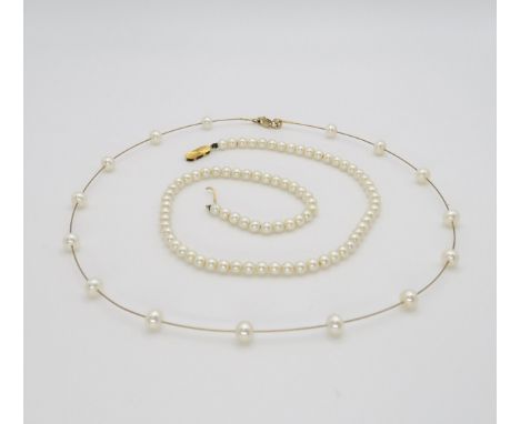 A 9ct gold ladies Rotary watch, a 9ct gold wire chain pearl necklace, and a string of pearls with a 9ct gold clasp, weight al