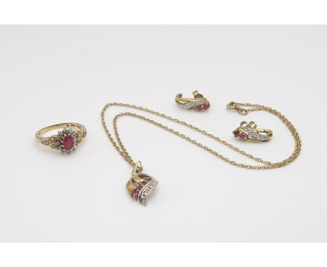 A 9ct gold ruby and diamond pendant on chain and matching earrings together with a similar ring set with diamonds and a red g