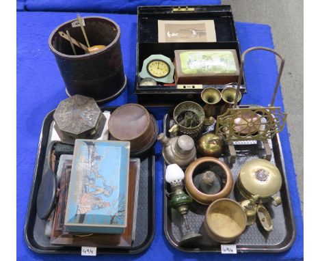 A lot comprising a green glass wall mounting oil lamp, brass candle holder, whisky ladles, tin strong box, Bournville Chocola