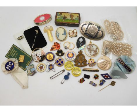 An Alpaca Mexico buckle, a salmon pin made by silversmiths Hjaltasteyn in Shetland, a Royal Corps Army Ordinance cap badge, e