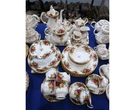 A Royal Albert Old Country Roses tea and dinner service comprising six dinner plates, four tea cups, seven saucers, four coff