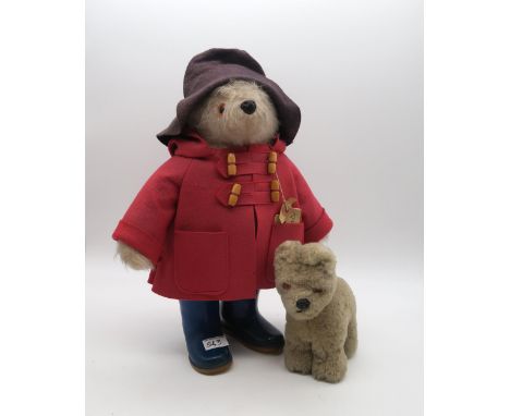 A Paddington teddy bear by Gabrielle Designs, wearing red felt coat and Dunlop Wellington boots, retaining luggage tag (thoug