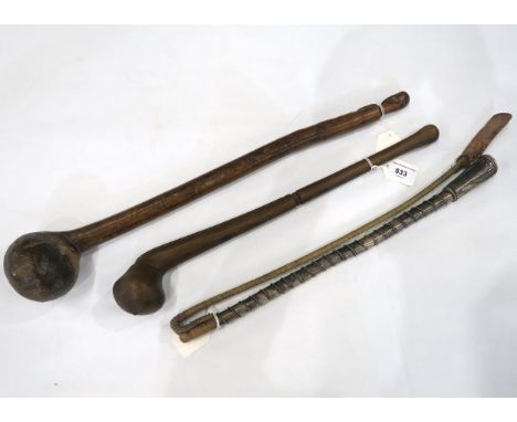 A riding (possibly camel) whip, with wire-would white metal handle; together with two Rungu-type hardwood throwing clubs, one