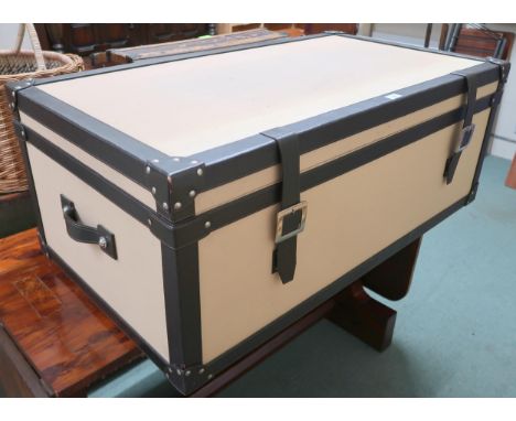 A contemporary leather bound trunk with canvas lined exterior, 42cm high x 112cm wide x 61cm deep Condition Report:Available 