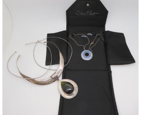 A silver and enamel Sheila Fleet 'Runes' pendant with matching earrings, together with a Mexican silver pendant and collar ne