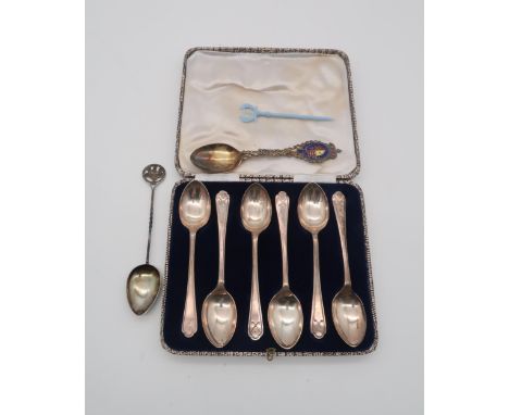 A cased set of silver coffee spoons, by Walker &amp; Hall, Sheffield 1933, the terminals with moulded decoration of crossed g