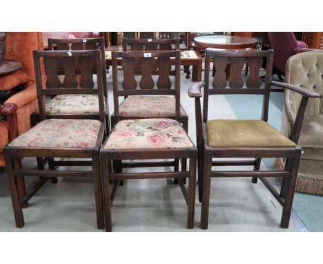 A lot of five mid 20th century early Ercol elm dining chairs with pierced splats over upholstered seats on square stretchered