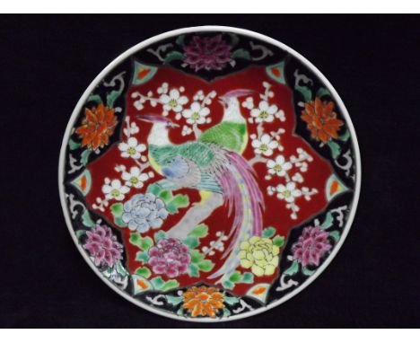 Chinese Famille Rose Plate. Enamel colours, 19th century heavy porcelain. Decorated with a pair of stylistic Birds in Apple B