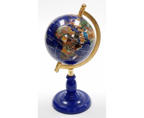 A miniature table top terrestrial globe, on a blue metal stand, 34cm high.