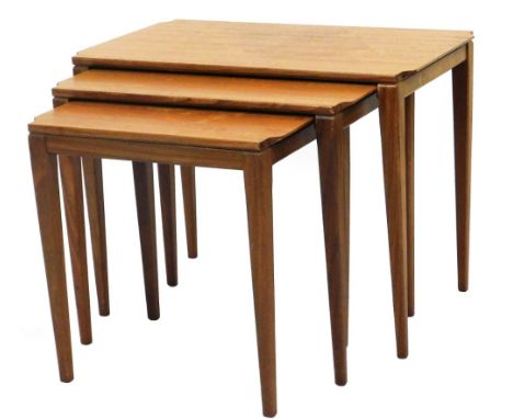 A nest of vintage teak tables circa 1960s, rectangular topped, on square tapering legs, the largest 51cm high, 64cm wide, 38c