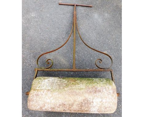 A vintage garden roller, on cast metal frame, with heavy stone roller base, 136cm high, 80cm wide. 