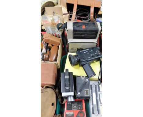 A group of camera equipment, to include a Bib video tape splicer, a Brownie camera, a Sanko video camera, a video cassette re
