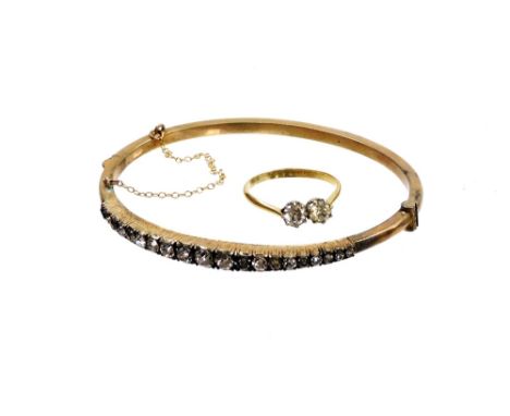 Two items of imitation diamond jewellery, to include a double dress ring, gold plated and a silver plated bracelet set with i