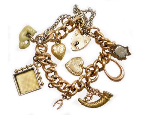 A 9ct gold charm bracelet, with various charms, on curb link bracelet, marked 9c to links, with a 9ct gold heart shaped padlo