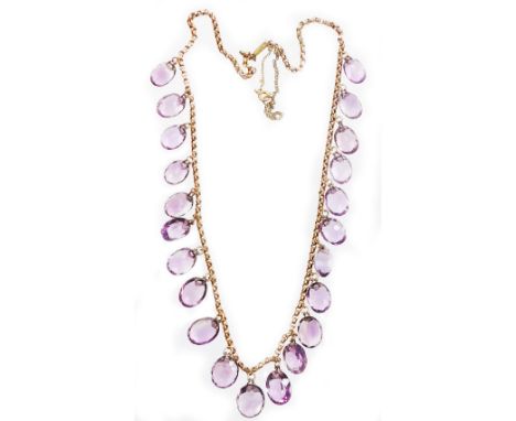 An Edwardian design amethyst graduated beaded necklace, set with twenty two oval cut amethysts, on a curb link chain, yellow 