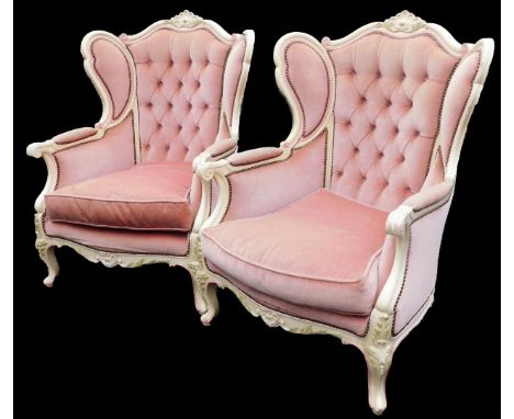 A pair of French style bedroom chairs, each with cream painted frames, on a pink draylon button back design seat, the borders