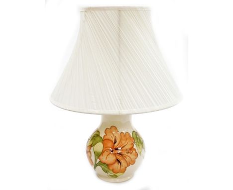 A Moorcroft baluster table lamp, coral hibiscus pattern, in cream with orange flower and green leaf decoration, stamped Made 