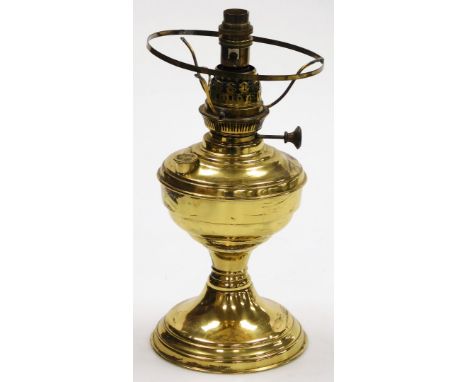 A Victorian brass oil lamp, converted to electricity, 34cm high.